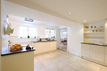 The spacious kitchen leads through into the open plan living/dining-room.
