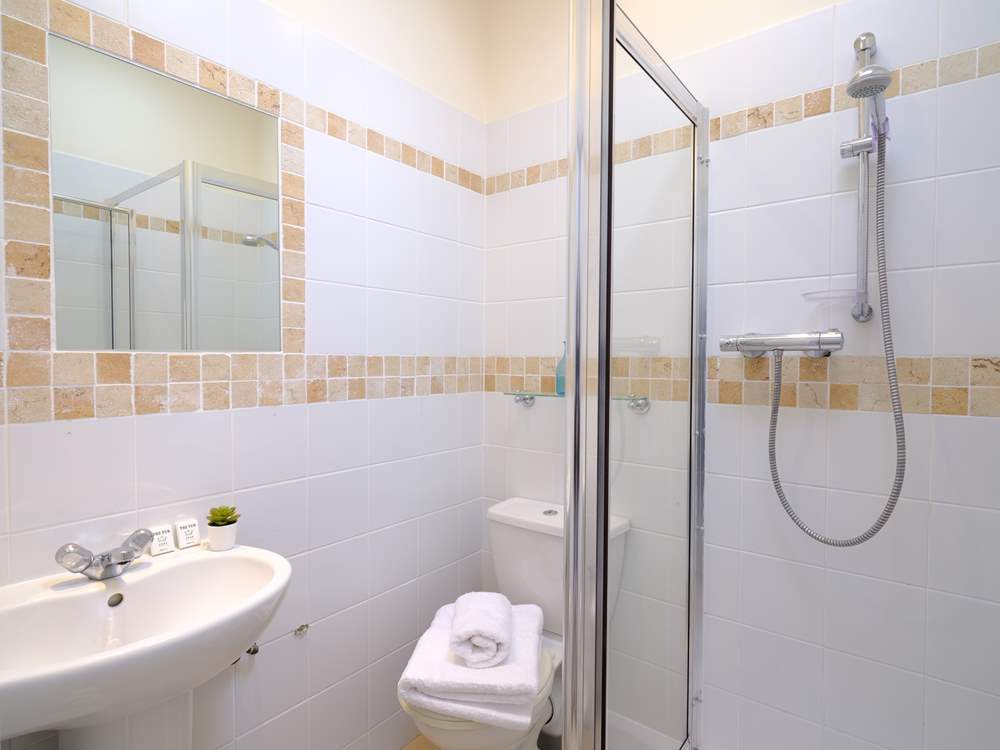 The en suite shower-room to Bedroom 6.