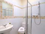 The en suite shower-room to Bedroom 6.