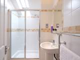 The en suite shower-room to bedroom 3.