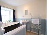 The en suite bathroom to bedroom 1 has a fabulous roll-top bath.