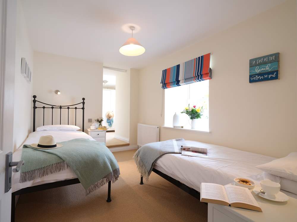 Pretty bedroom 4 has twin beds.