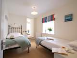 Pretty bedroom 4 has twin beds.