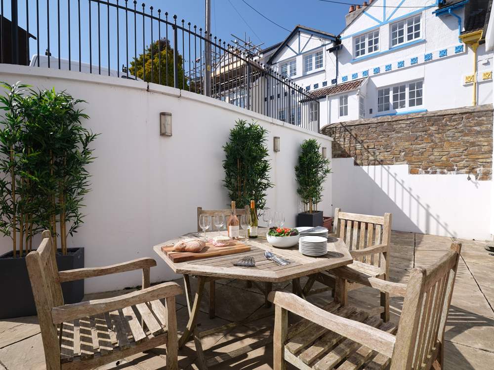 The courtyard off the open plan living/dining-room is a delightful place for al fresco dining.