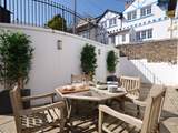 The courtyard off the open plan living/dining-room is a delightful place for al fresco dining.