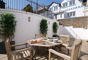 The courtyard off the open plan living/dining-room is a delightful place for al fresco dining.