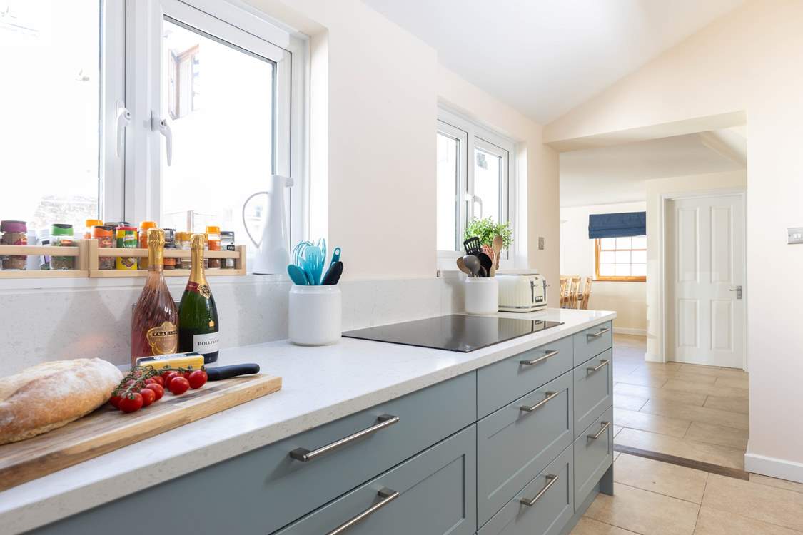 The kitchen is next door to the living area.
