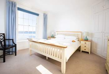 Bedroom one with a king-size bed and outreaching views towards Falmouth and St Anthony Head.