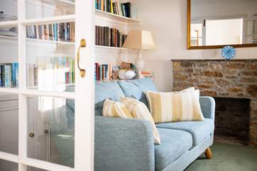Don't forget to bring a book and get comfy on this cosy sofa in the living room.