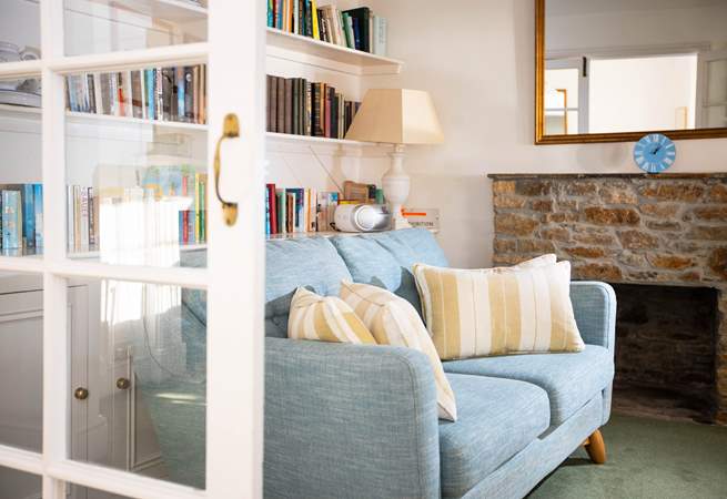 Don't forget to bring a book and get comfy on this cosy sofa in the living room.