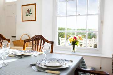 Look out to the outdoor seating area from the dining room.