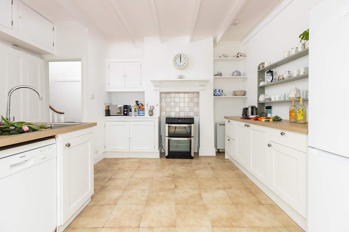 The light and bright kitchen is a delight.
