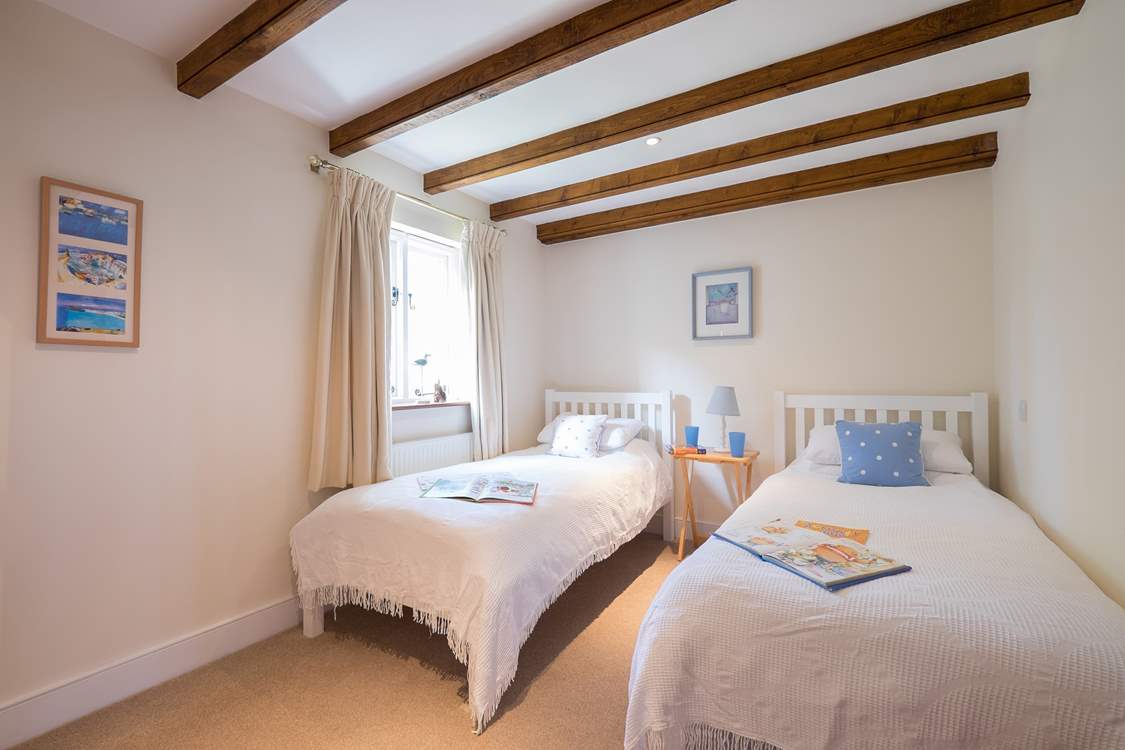 Bedroom 1 on the ground floor has twin beds, ideal for either children or adults.