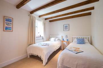 Bedroom 1 on the ground floor has twin beds, ideal for either children or adults.