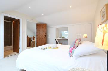 Bedroom 2 is spacious and has the added benefit of an en suite shower-room.