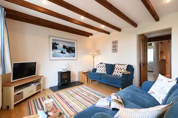 The cosy sitting-room is furnished with comfort in mind.