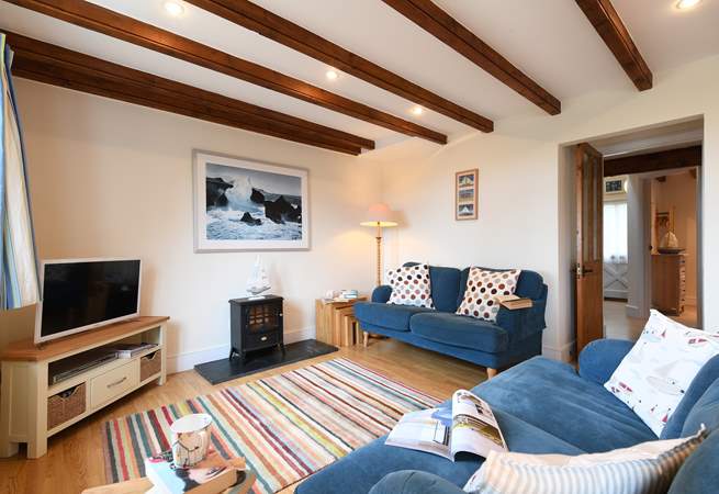 The cosy sitting-room is furnished with comfort in mind.