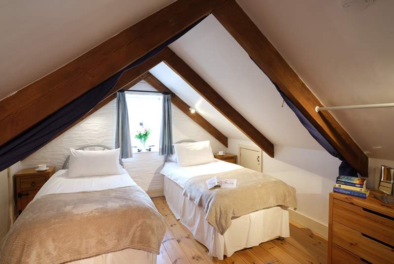 The open mezzanine bedroom has zip and link beds offering either twins or a double bed.