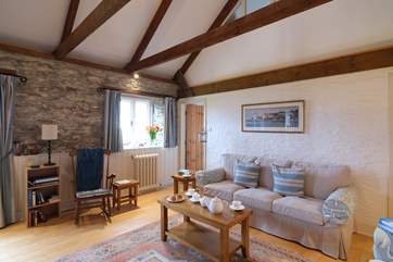 Beams and exposed stonework give the barn lots of character.