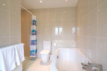 The family bathroom has a large wet room shower.