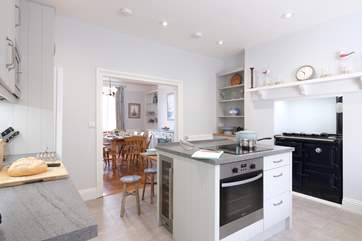 The kitchen area showing the ornamental Rayburn, looking towards the dining-room.