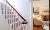 The elegant staircase leads up from the front hall. - Thumbnail Image