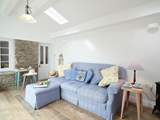 Relax with a good book in the garden-room which overlooks the rear courtyard.