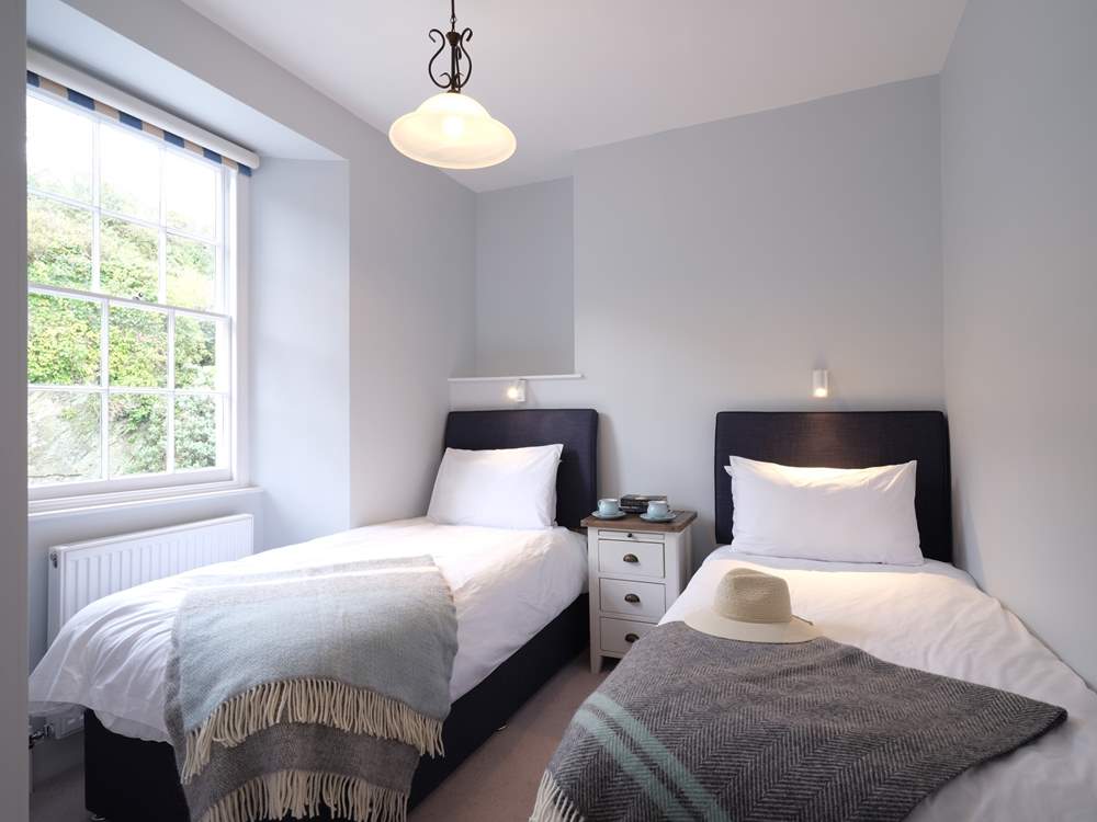 Bedroom 5 overlooks the rear courtyard.