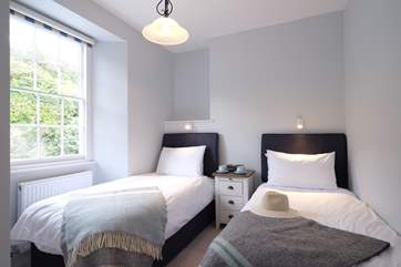 Bedroom 5 overlooks the rear courtyard.