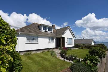 The exterior of Mor Gwyns with the sea in the background.