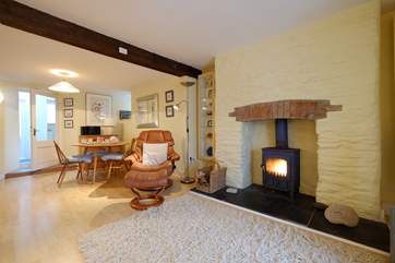 There is a warming wood-burner in the sitting/dining-room.