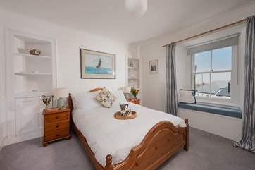 There are sea glimpses from the window seat in the double bedroom.