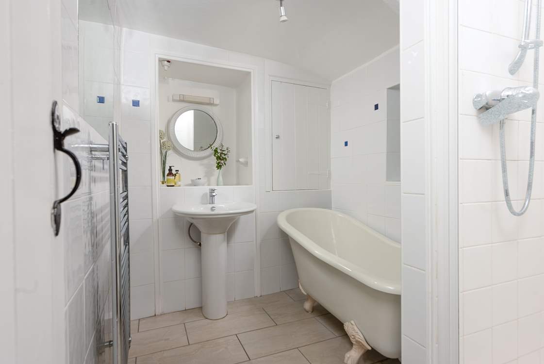 The ground floor bathroom has a separate shower cubicle as well as a bath.