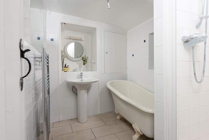The ground floor bathroom has a separate shower cubicle as well as a bath.