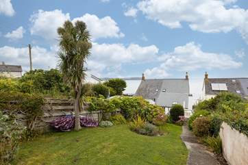 The rear garden at Pengerrans has two terraces for sitting out.
