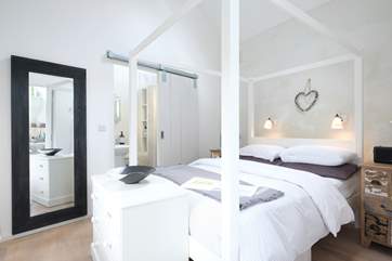 A sliding barn style door leads into the shower room.