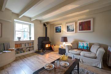 The sitting-room has a lovely wood-burner.