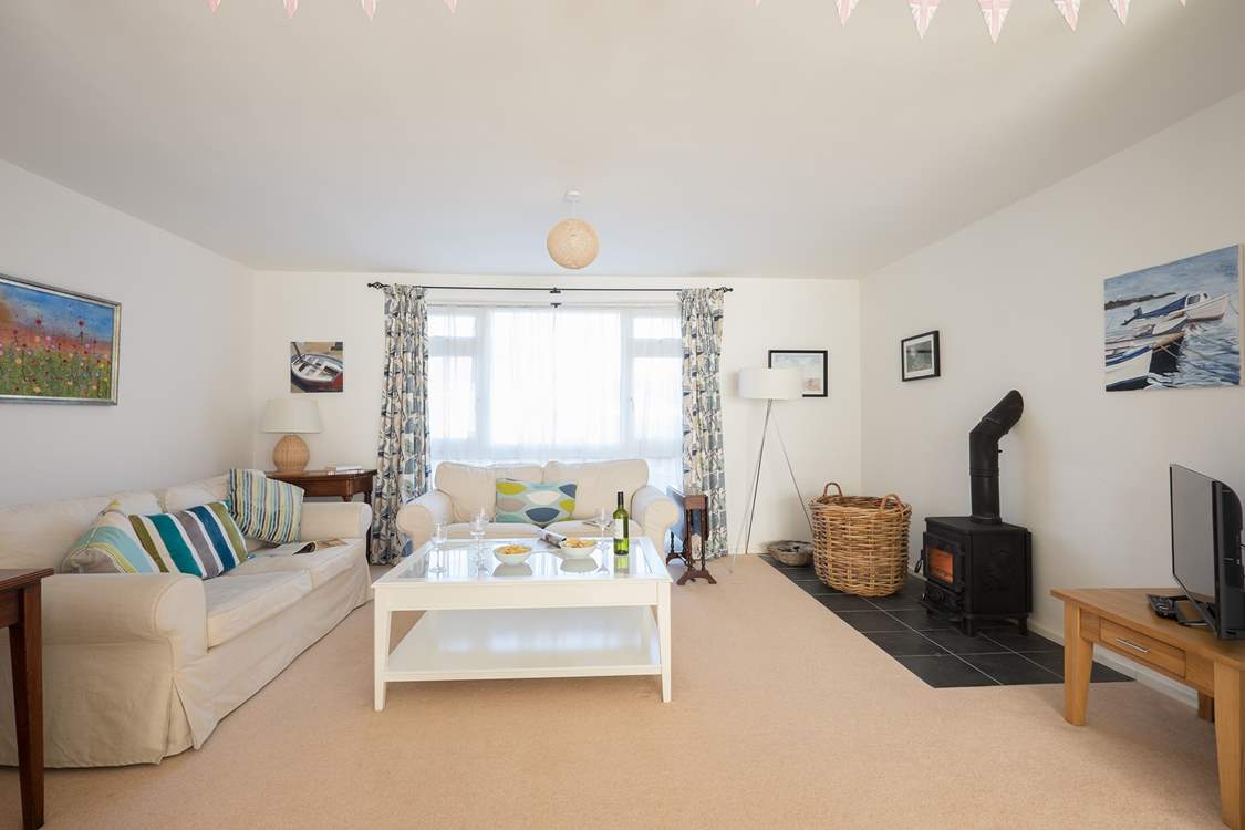 Relax in the sitting-room with super comfy sofas and a warming wood-burner for cooler months.