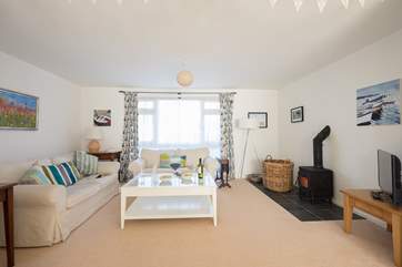 Relax in the sitting-room with super comfy sofas and a warming wood-burner for cooler months.