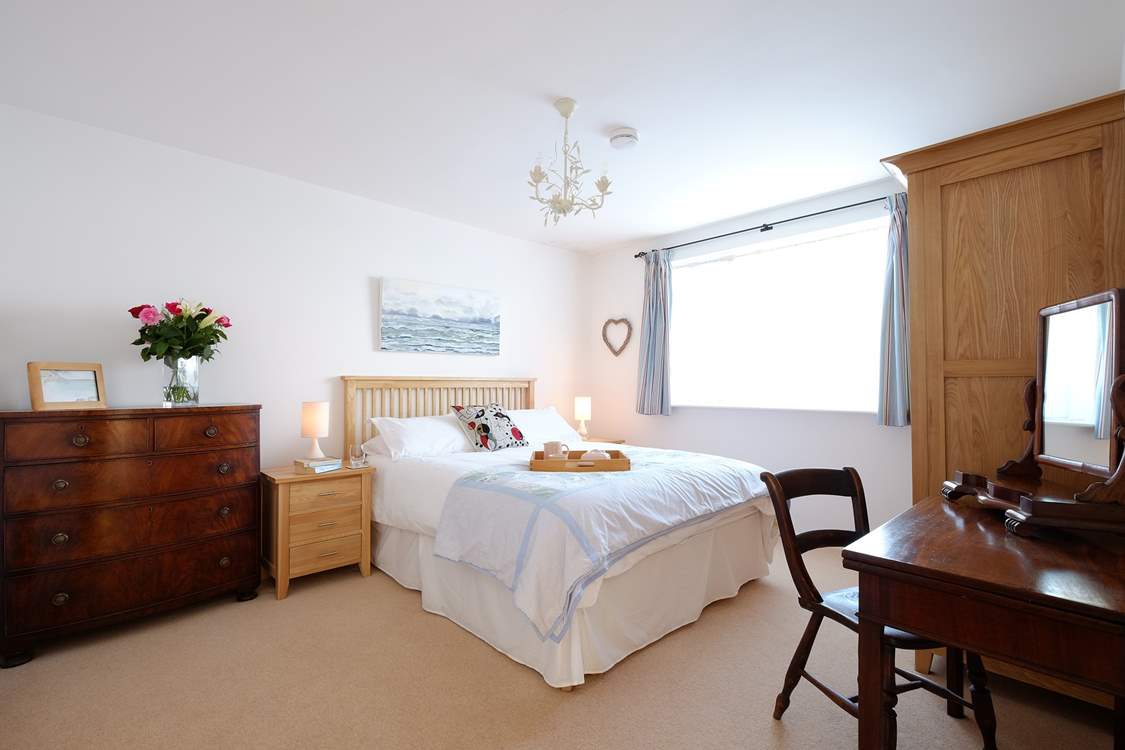 Spacious bedroom 1 has a king-size bed.