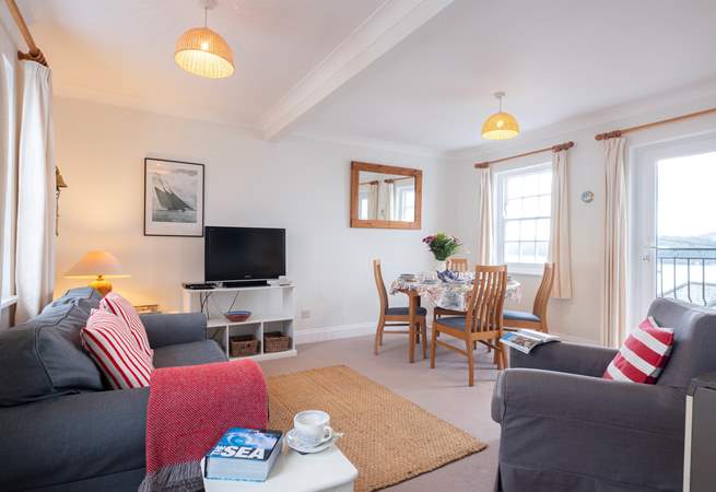 The delightful sitting-room is furnished in nautical colours.