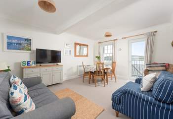 The delightful sitting-room has gorgeous sea views and is furnished in nautical colours.