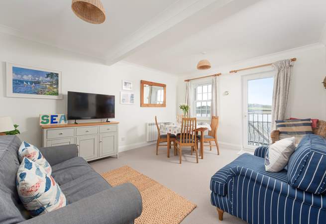 The delightful sitting-room has gorgeous sea views and is furnished in nautical colours.