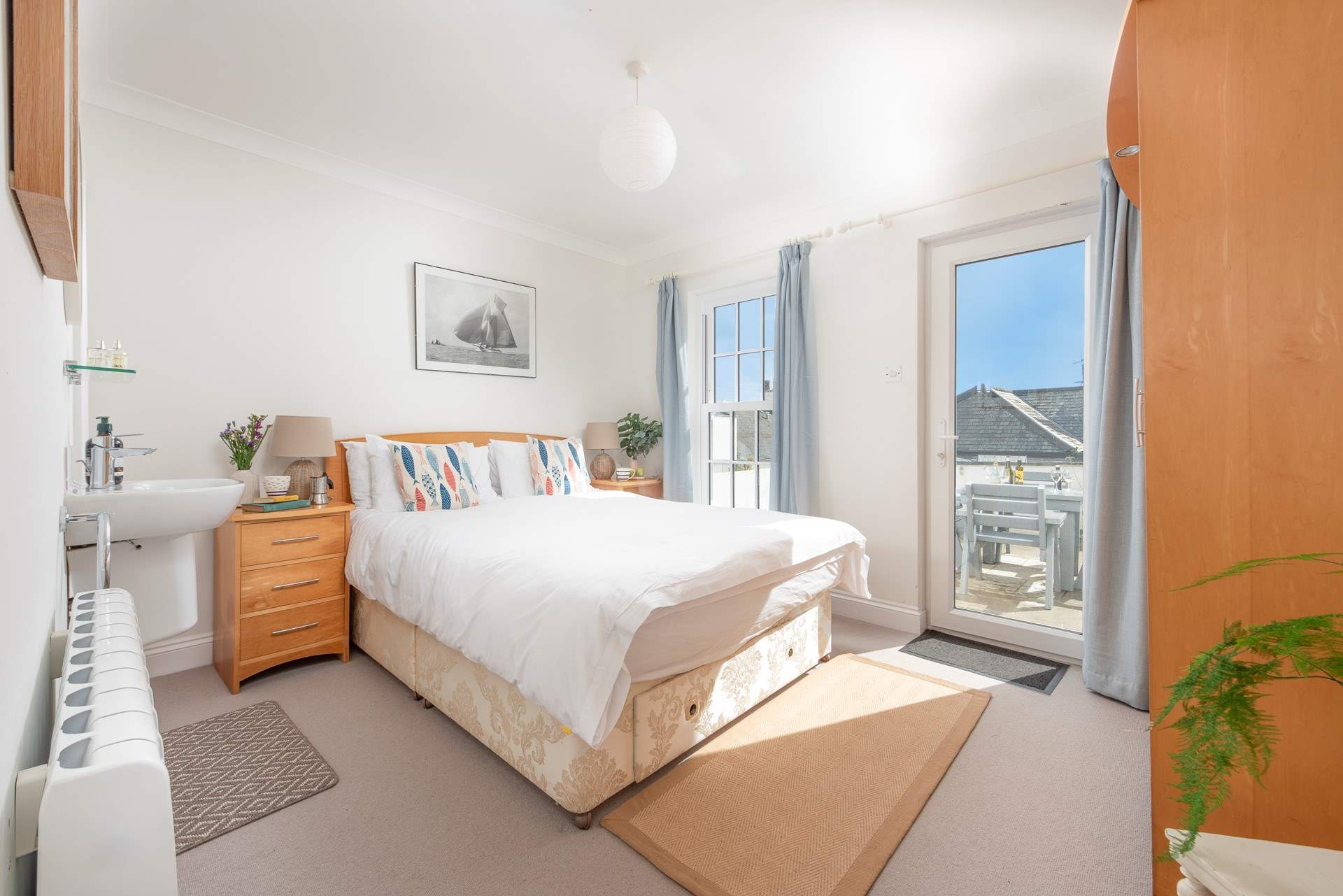 Pretty bedroom 1 has a king-size bed and access to the patio.