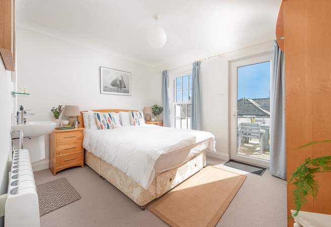 Pretty bedroom 1 has a king-size bed and access to the patio.