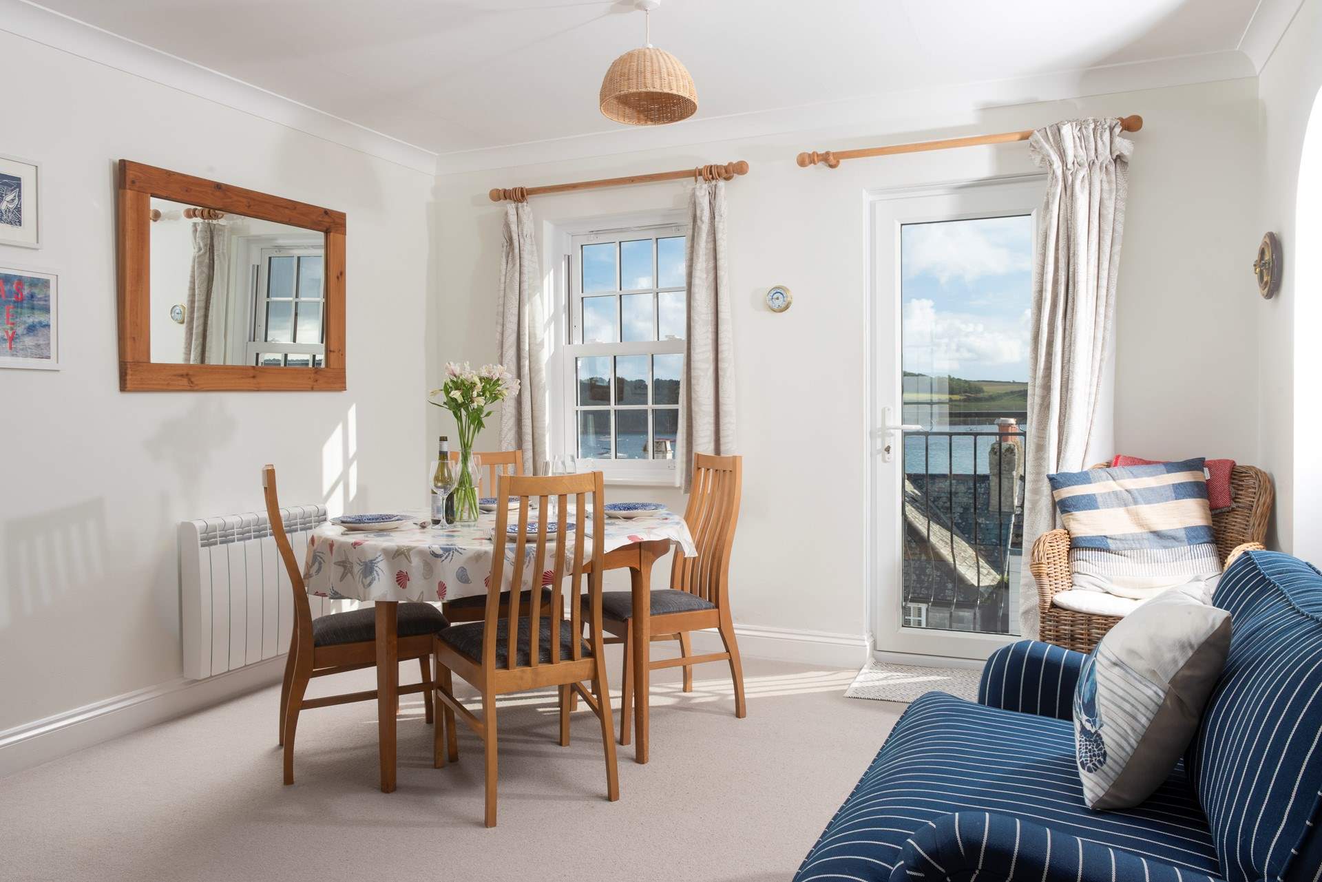 Open the door and enjoy the sea view from the Juliet balcony.