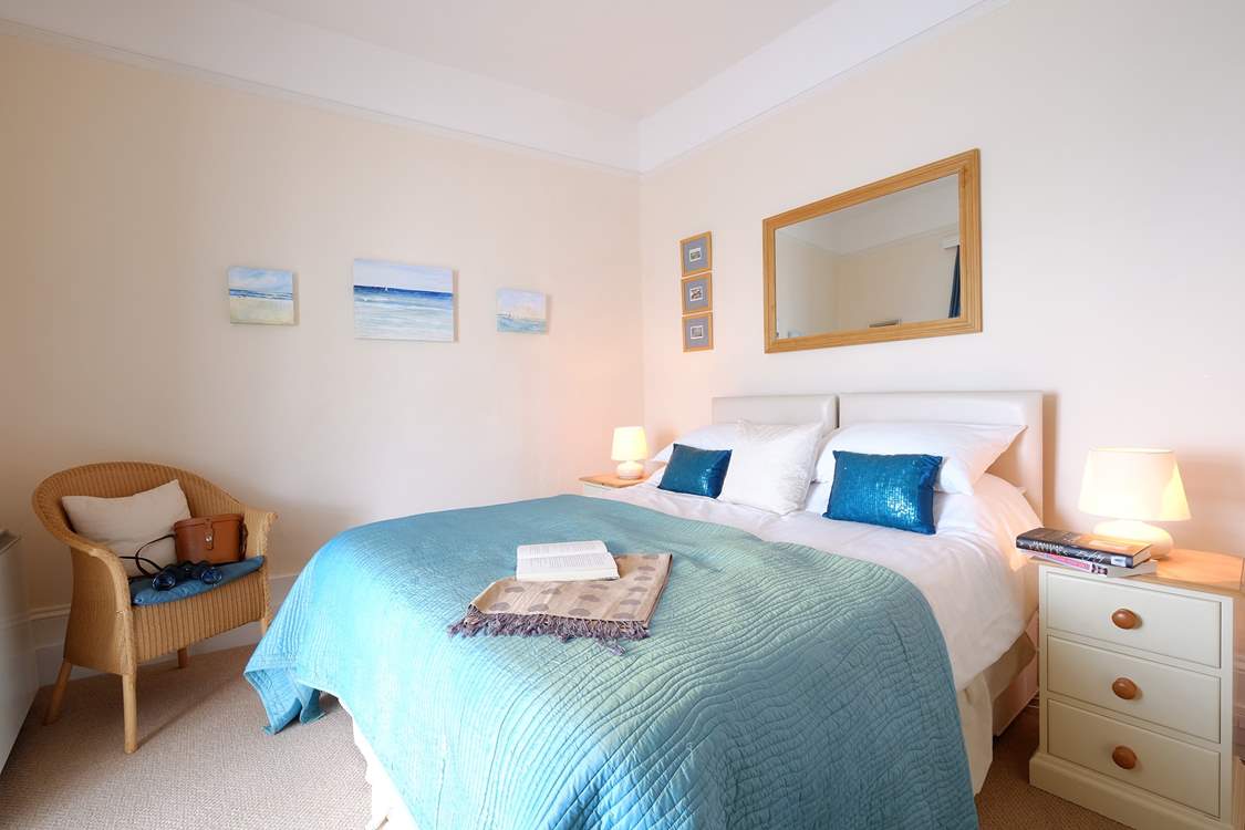 Bedroom 1 has lovely linens and a comfy bed.