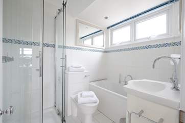 The bathroom has a bath and separate walk-in shower.