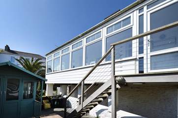 Climb the steps to this seafront apartment.