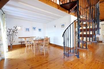 The spiral staircase leading up to the mezzanine games-area.